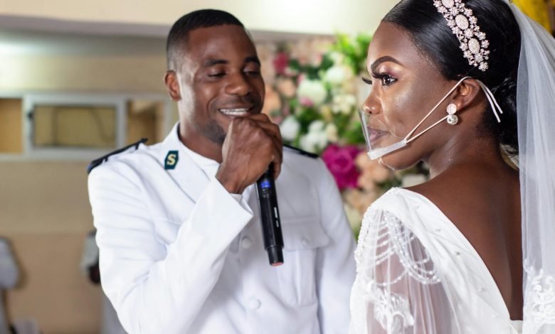 a bride and groom during their wedding vows